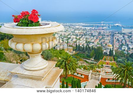 The cityscape of Haifa from the Carmel Mount with the ornamental Bahai Gardens and Mediterranean coast on the background Israel.