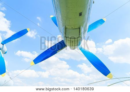 Vintage airplane propeller on blue sky background