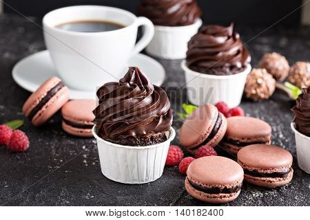 Chocolate cupcakes with thick and glossy ganache frosting