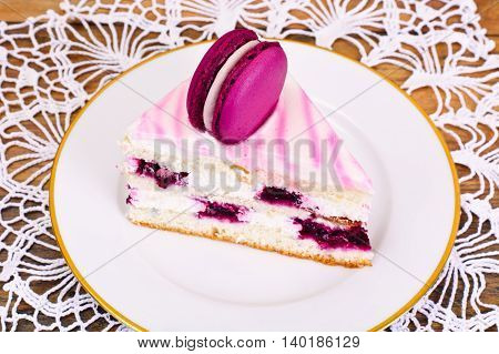 Sweet and Colourful Cake with French Macaroons. Studio Photo