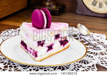 Sweet and Colourful Cake with French Macaroons. Studio Photo