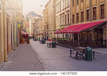 LVIV UKRAINE - MAY 8 2016: Morning in the center of Lviv. Empty old-style streets full of cafes and restaurants Ukraine