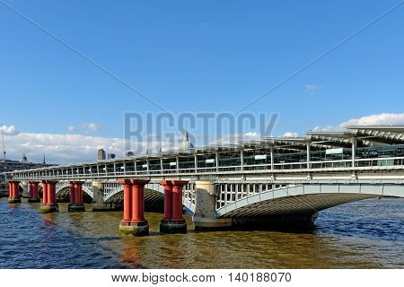 Remains of old and the new railway bridge at Blackfriars river Thames London