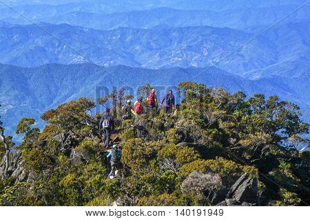 Ranau,Sabah Borneo-March 13,2016:Group of climbers move down by wooden stairs to Laban Rata hut after successfully completed conquering the summit of mountain Kinabalu at Ranau,Sabah on 13th March 2016