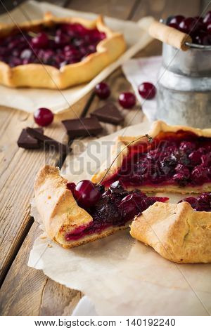 Gallet with cherries and bitter chocolate. Selective focus.