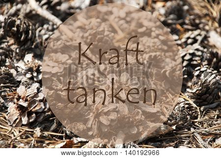 Texture Of Fir Or Pine Cone. Autumn Season Greeting Card. German Text Kraft Tanken Means Relax