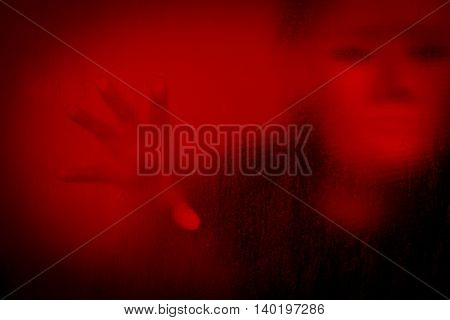Woman wearing white mask behind stained or dirty window glass,Scary background for book cover