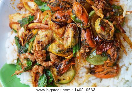 spicy stir-fried mussel and dolly fish with finger root on rice