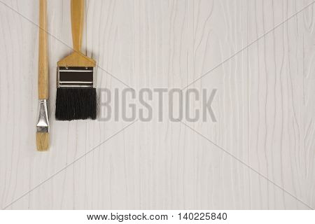 Paint brush on white pattern background suitable for background paint or background diy or background decorate house and equipment or household.