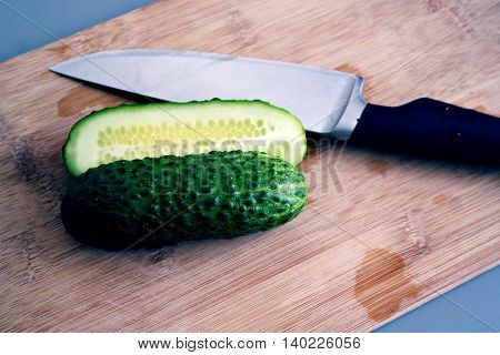 fresh green cucumber cut in half for making salad