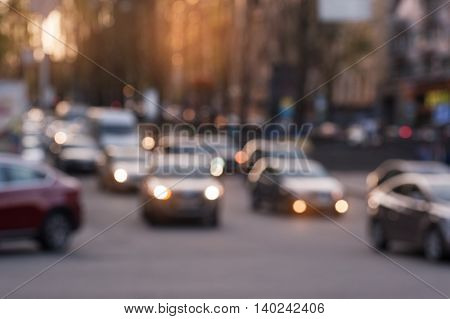 car driving on evening city street. blurred focus.