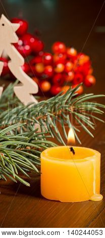 still life with christmas decoration and a candle