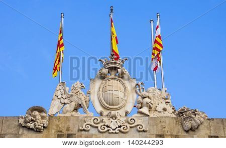 Flags of Catalonia on The City Hall against a blue sky