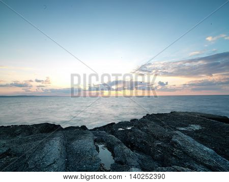 Long exposure shot on amazing pink rocks and sea