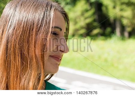 The Sun's rays fall on the beautiful face of a model. Summer,