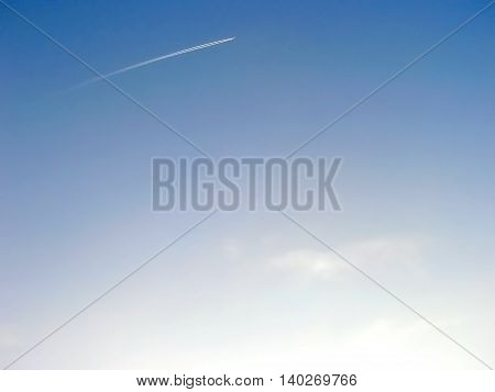 Clean sky with small airplane far away