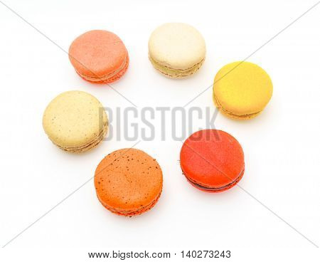 French colorful macarons on white background