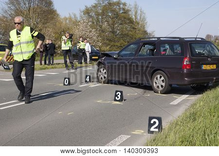 Bovenkarspel, the Netherlands - May 5, 2016: The traffic police do a thorough investigation Following an Accident Involving several at cars, s were bettrokken. and the road for a few hours was Deposited for safety.