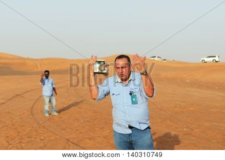 DUBAI UAE - SEPTEMBER 12: The Dubai desert trip in off-road car is major tourists attraction in Dubai on September 12 2013 in Dubai UAE