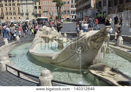 Rome Italy - June 29 2016: tourists visiting the Piazza di Spagna in Rome. Tourists around the fountain 