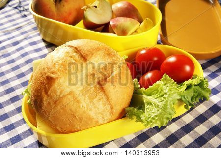 Cooking lunchbox - sandwich with cheese and fresh vegetables (pepper, tomatoes, lettuce)