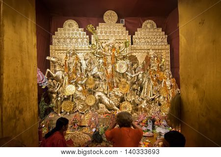 KOLKATA INDIA - OCTOBER 18 2015 : Night image of decorated Durga Puja pandal shot at colored light at Kolkata West Bengal India. Durga Puja is biggest religious festival of Hinduism.