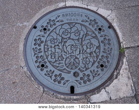 OSAKA, JAPAN - JUNE 09, 2016: The Flowers was engraved on manhole cover around Osaka Castle in Osaka, Japan.