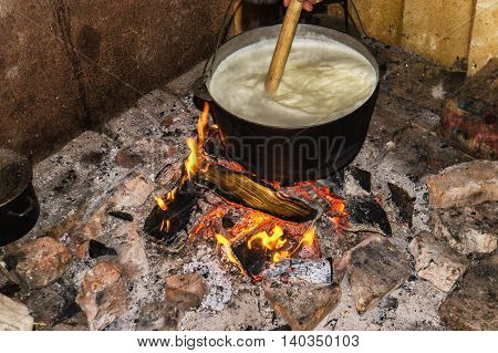 Cooking Fires In A Black Iron Pot