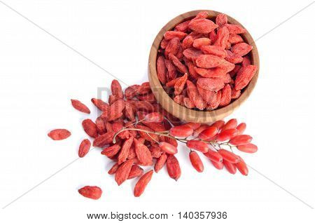 berberries near goji berries heap and bowl with goji isolated on white background.top view