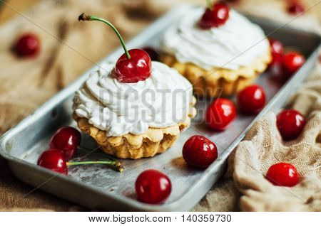 Beautiful Chocolate Cupcakes With White Protein Cream And Cherry
