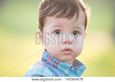 cute boy is looking somewhere caucasian child