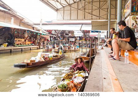 Damnoen Saduak Thailand-20 March 2016. Busy sunday morning at Damnoen Saduak floating market. Ratchaburi Thailand place of locals selling fresh produce cooked food and souvenirs.