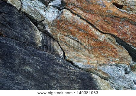 Background: stone picturesque relief,  multicolored rock texture