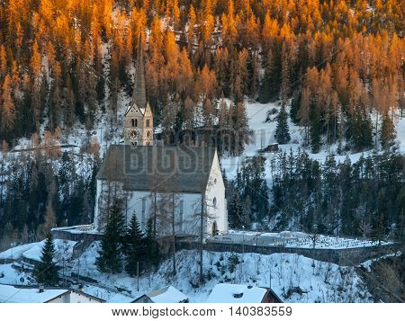 Small gothic church in Scuol village, Graubunden, Switzerland