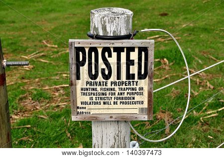 Ronks Pennsylvania - October 13 2015: A no trespassing sign posted on a wired fence on a local farm