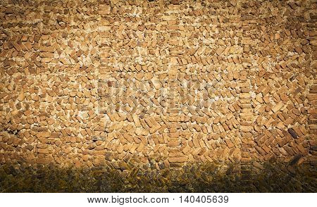 a brick wall that seems to have many years