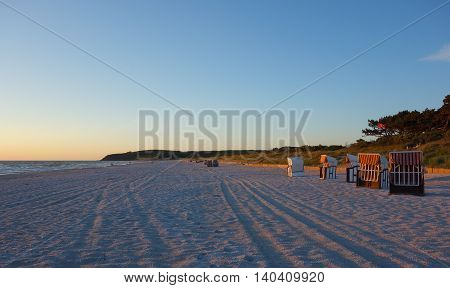 Beach with beach chairs at sunset on Hiddensee Island Germany