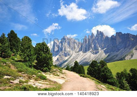Hiking path in the Alps on summer, Italy