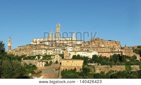 Siena Italy - medieval city centre with town hall tower cathedral and Santa Maria della Scala former hospital
