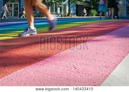 Pride Rainbow Crosswalk, Vancouver. Pedestrians using the rainbow colored crosswalk in downtown Vancouver.