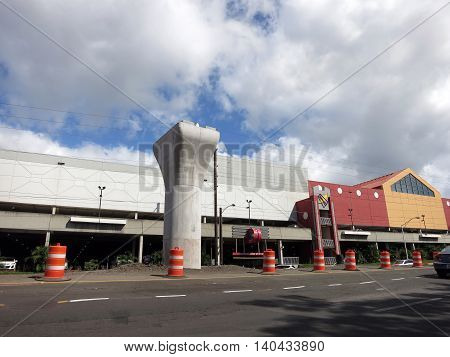 HONOLULU - NOVEMBER 29: HART Light Rail concrete guideway under construction in road center in Pearl City on Oahu Hawaii on November 29 2015. HART is building a 8 billlion dollar railway linking Oahu communities.