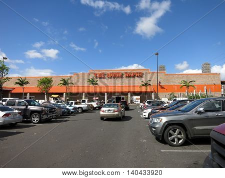 Honolulu HI USA - August 4 2015: Oahu Home Depot parking lot filled with cars. Founded in 1978 The Home Depot is a retailer of home improvement and construction products and services. It is the largest home improvement retailer in the USA.