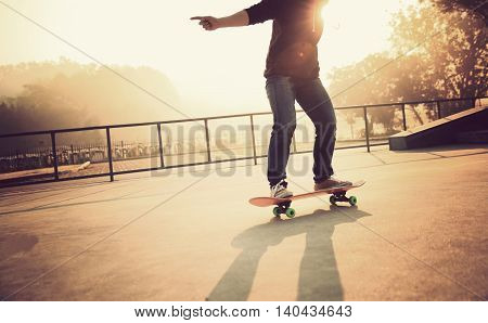 one young woman skateboarder skateboarding at skatepark