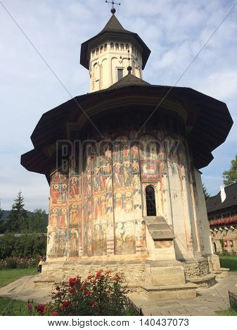 Romania, August 23, 2015, Vatra Moldovitei, North Moldova, View over the back painted monastery wall