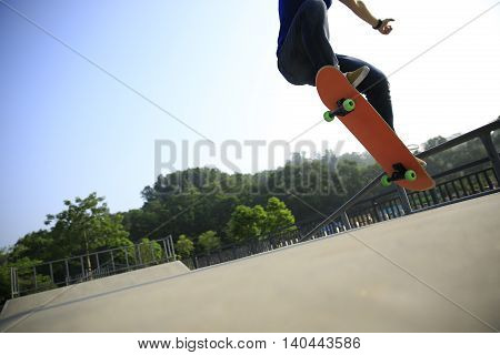one young skateborder skateboarding at skatepark ramp