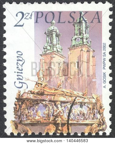 MOSCOW RUSSIA - CIRCA APRIL 2016: a post stamp printed in POLAND shows a view of Gniezno town the series "Polish cities" circa 2002