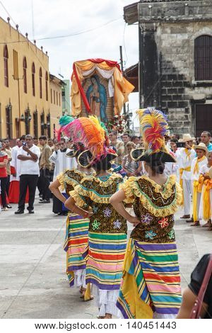 Leon Nicaragua - December 12 2015: Aborigen dancers in typical dress celebrating on the street