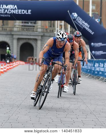 STOCKHOLM SWEDEN - JUL 02 2016: Group of male triathlete cyclists Kristian Blummenfelt (NOR) and competitors in the Men's ITU World Triathlon series event July 02 2016 in Stockholm Sweden