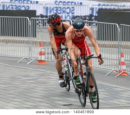 STOCKHOLM SWEDEN - JUL 02 2016: Male triathlete cyclists Andreas Schilling and Xavier Grenier-Talavera in the Men's ITU World Triathlon series event July 02 2016 in Stockholm Sweden