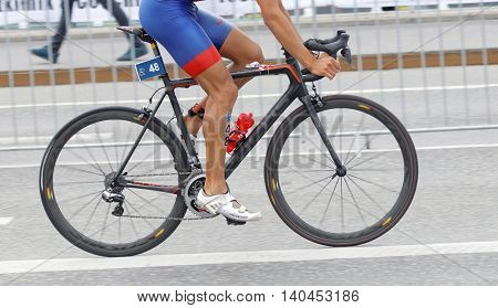 STOCKHOLM SWEDEN - JUL 02 2016: Side view of male triathlete cyclist without torso in the Men's ITU World Triathlon series event July 02 2016 in Stockholm Sweden